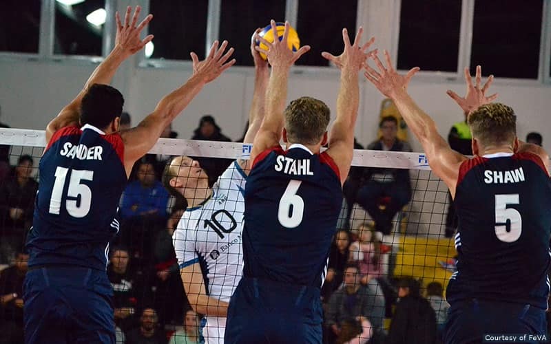 U.S. Men's volleyball players block against Argentina