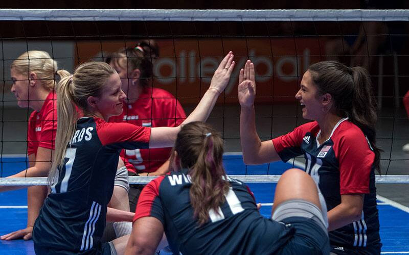 Tia Edwards and Kaleo Maclay of the U.S. Women's Sitting Team high five