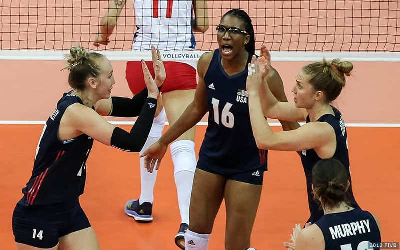 Michelle Bartsch-Hackley, Foluke Akinradewo and Carli Lloyd celebrate during U.S. Women's victory over Serbia