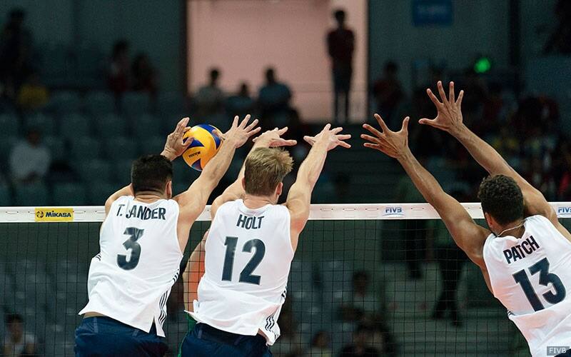 Taylor Sander gets his hands on the ball as part of a triple block