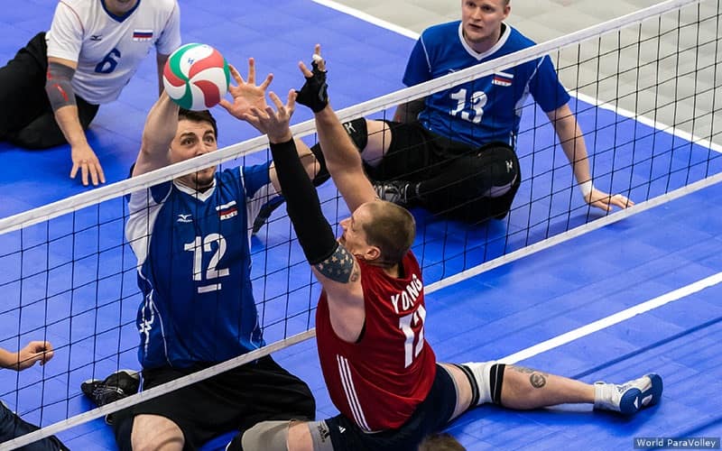 Patrick Young of the U.S. Men's Sitting Team blocks against Russia