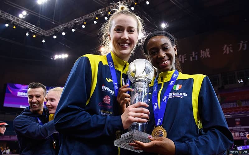 Kim Hill (left) and Chiaka Ogbogu with the FIVB Women's Club World Championship trophy