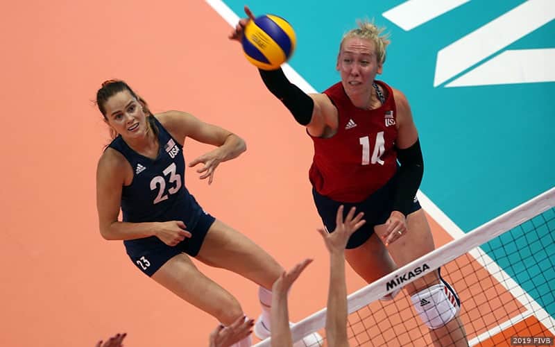 Michelle Bartsch-Hackley swinging for a kill while libero Kelsey Robinson awaits a possible cover