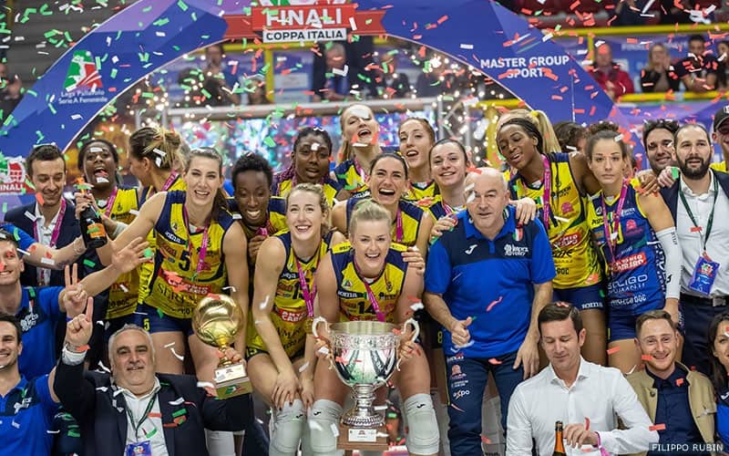 Kim Hill and Chiaka Ogbogu celebrate winning the Italian Cup with their Imoco Volley Conegliano teammates