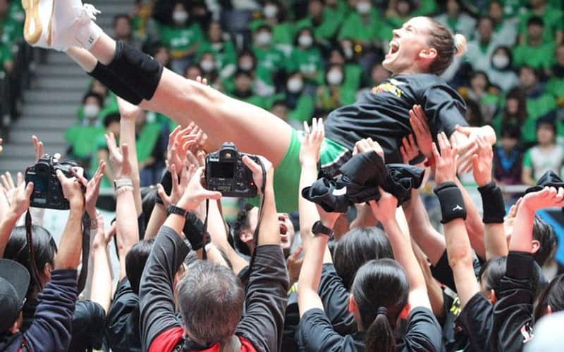 Annie Drews is lifted up by her JT Marvelous teammates after they win the Japan V-League title