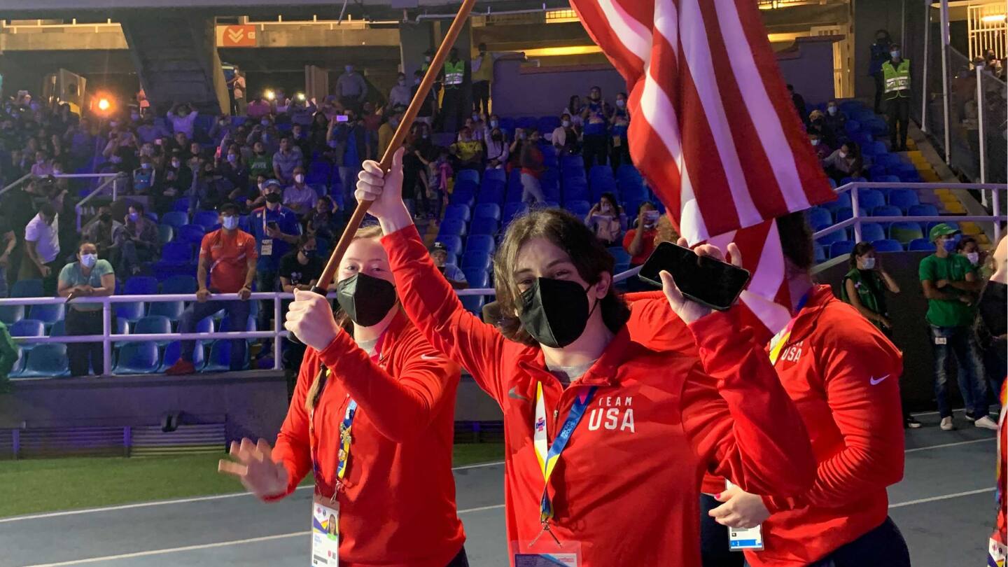 Hampton Morris and Olivia Reeves carry the flag into Opening Ceremony