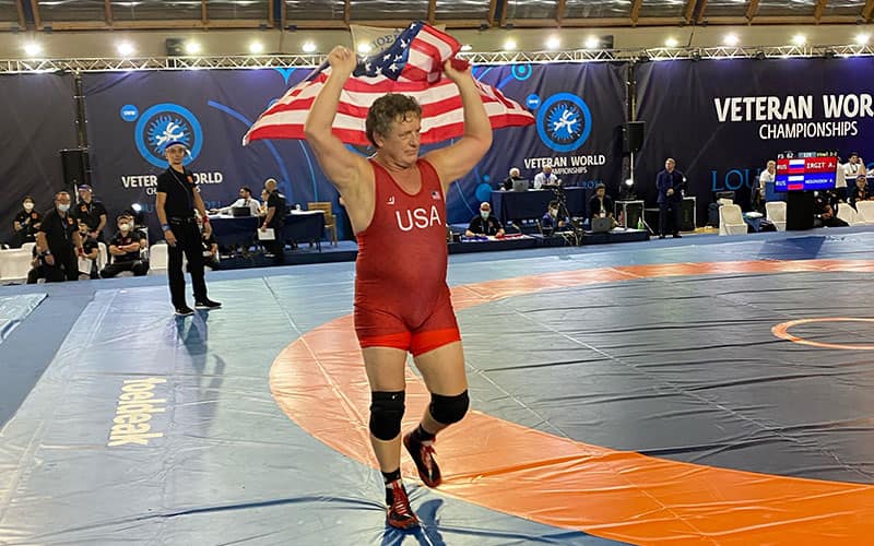 Veterans World Champion Dan Chaid with the American flag