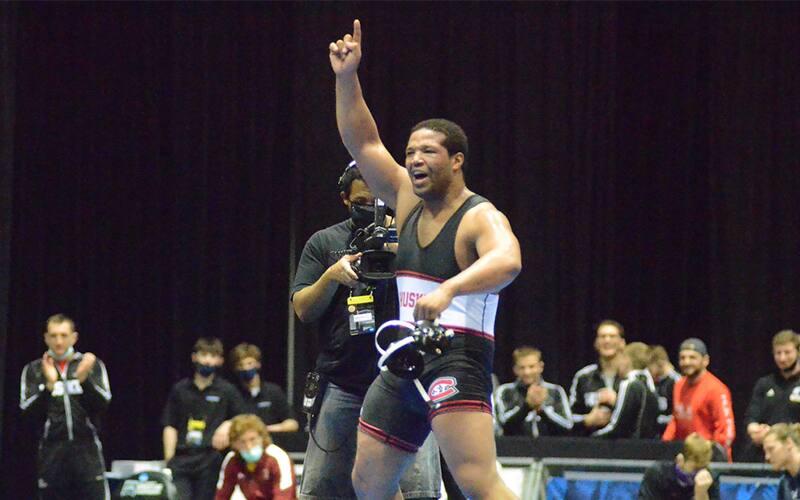 Kameron Teacher points to sky in celebration of his NCAA title.