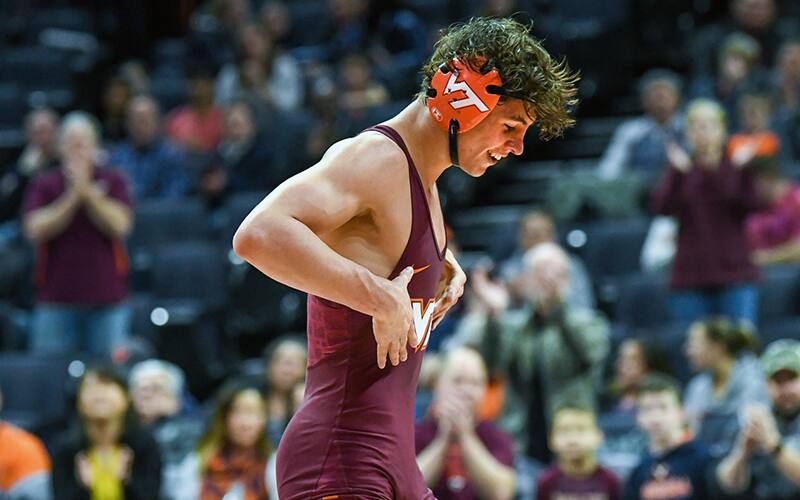 Bryce Andonian celebrates after a win over his opponent from Missouri
