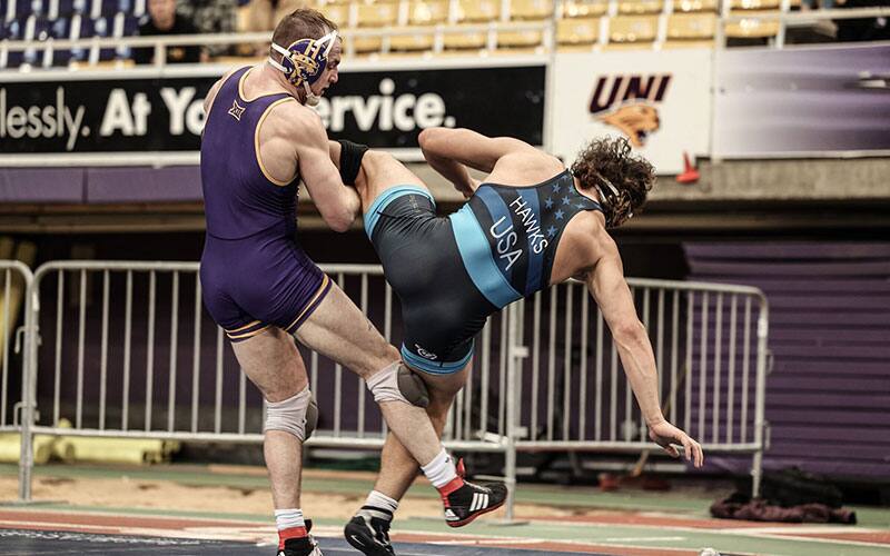 Parker Keckeisen (UNI) trips an opponent for the takedown