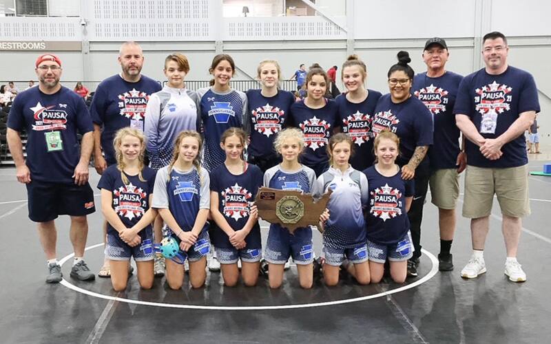 Pennsylvania, the 14U Girls National Duals champion, pose with their trophy