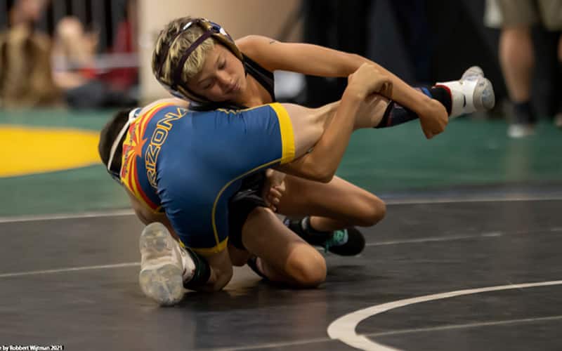 A youth wrestler scores a takedown during Spartan Nationals