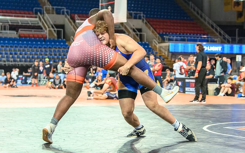 Chase Horne chases down a double leg  from the middle of the mat.