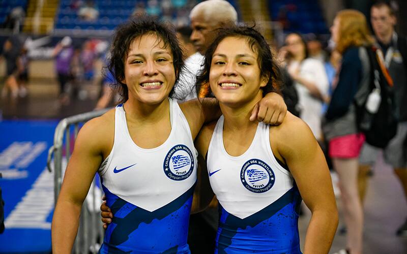 Gonzalez twins pose next to one another after their semi-finals win. 