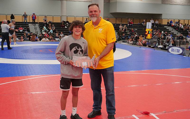 Keyan Hernandez of the Team Champs WC of Montana receives OW award from Rob Cate