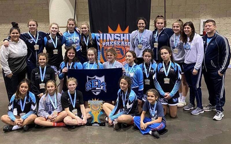 Wyoming Seminary girls team poses together after winning the Sunshine National Duals