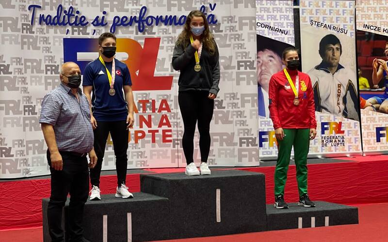 Emma Bruntil (USA) stands on top of podium after winning Ion Corneanu International in Romania.