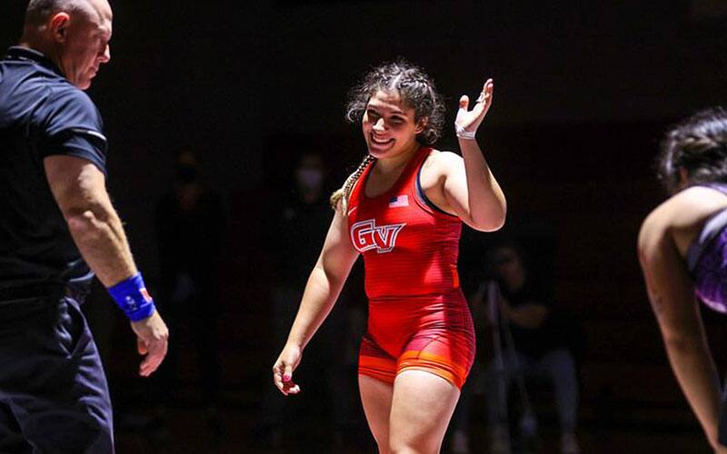 A Grandview women's wrestler waves after a victory