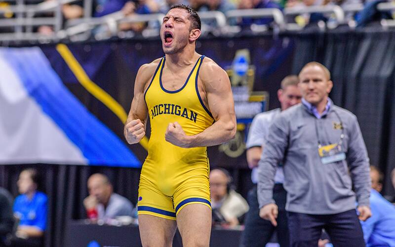 Michigan's Myles Amine celebrates after a win at the 2019 NCAAs
