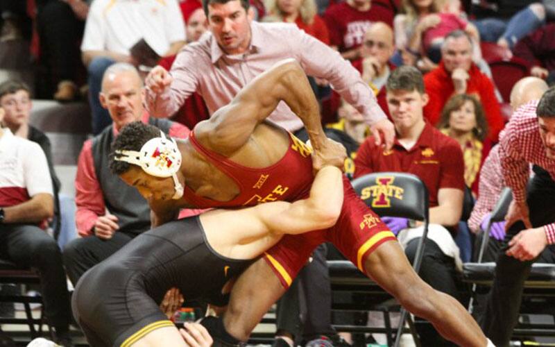David Carr of Iowa State, with Coaches Kevin Dresser and Brent Metcalf in background