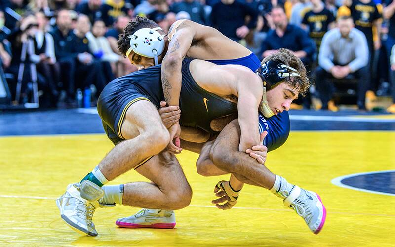 Austin DeSanto and Roman Bravo Young wrestle in a scramble
