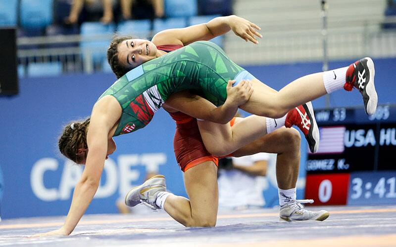 Katie Gomez (USA) scores a takedown at the 2021 Cadet Worlds