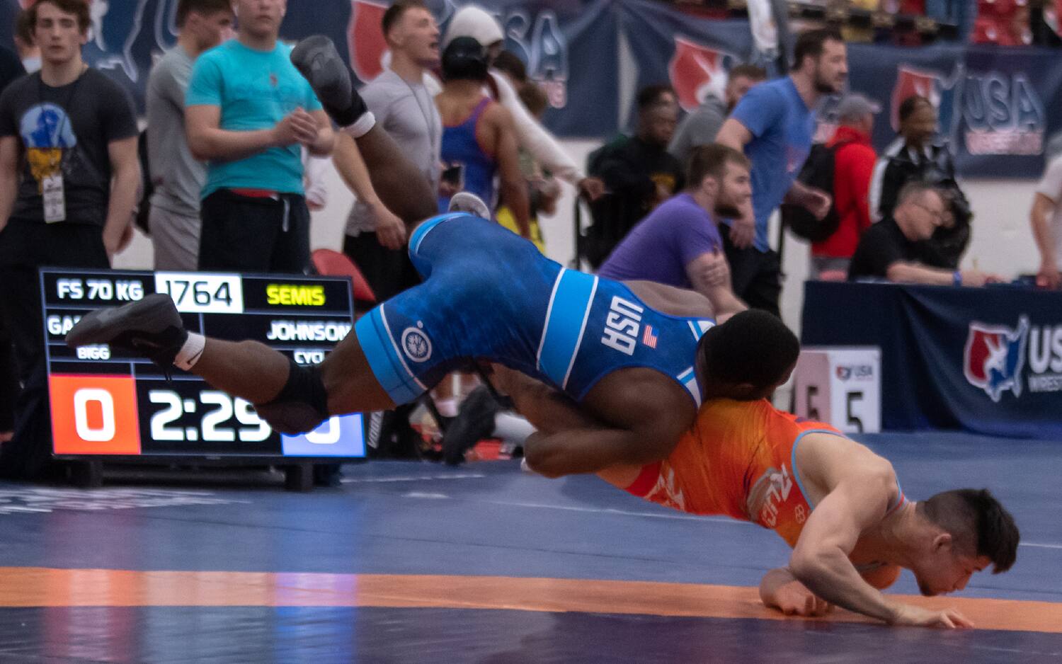 Paniro Johnson catches air as he drives his opponent down with a double leg in at the U20 freestyle World Team Trials
