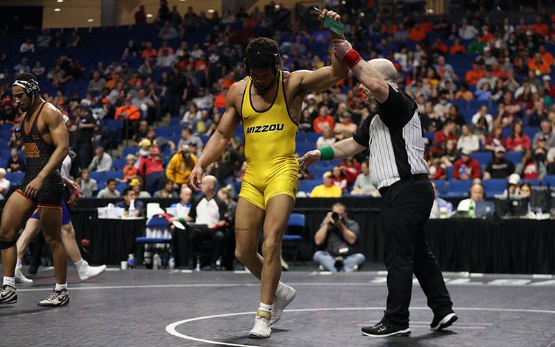 Jeremiah Kent (Missouri) with his hand raised at the Big 12 Championships