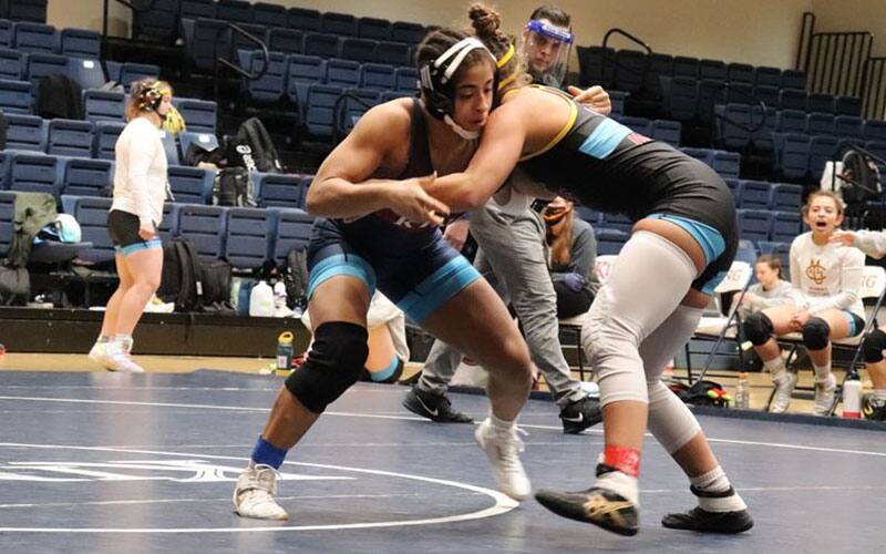 Ana Luciano (King) pummels with an opponent