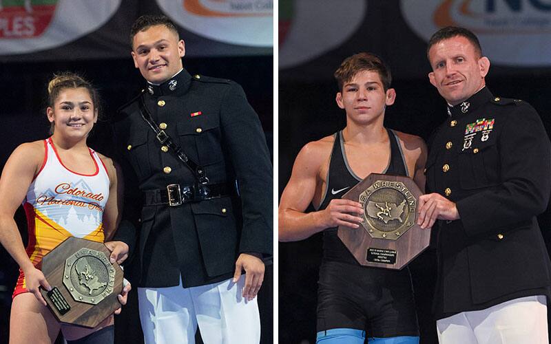 Two national champions from Fargo posing with a U.S. Marine and their championship stop sign trophy