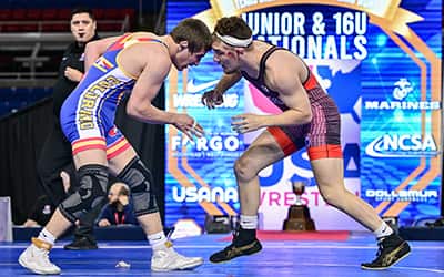 Braden Stauffenberg of Illinois matches head position with his opponent