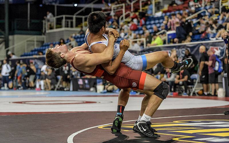 Tristan Steldt of Wisconsin tosses his opponent belly to back in the 16U Greco-Roman semifinals