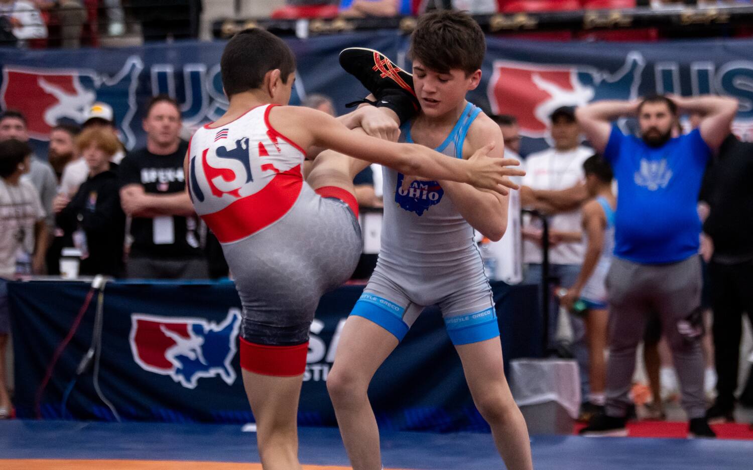 Grey Burnett treetops his opponent in the finals bout of U15 Nationals.