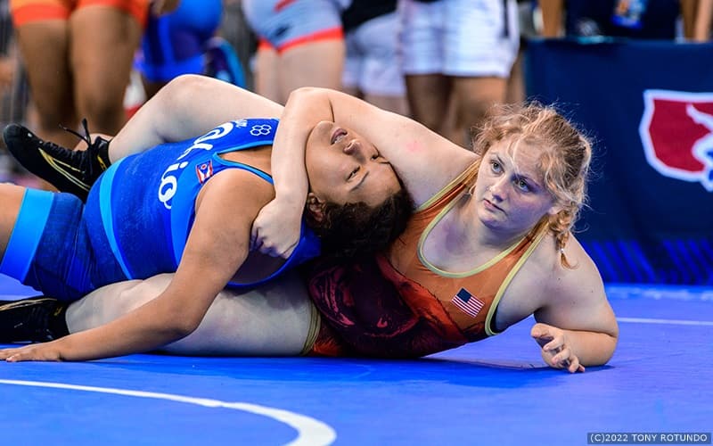 Sam Calkins of California works to pin her opponent. 