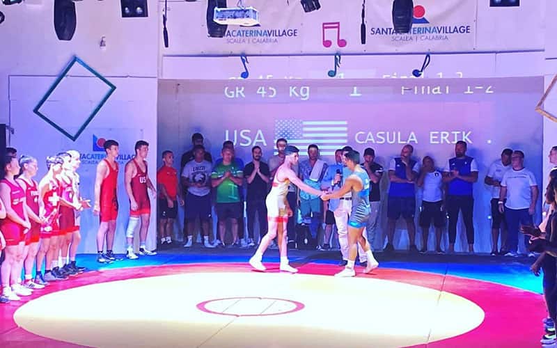 Youth shake hands prior to Italy vs. World All-Stars dual meet. 