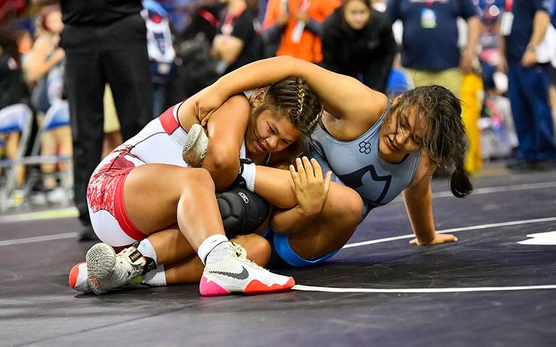 Sabrina Nauss (MI) works to secure an ankle lace.