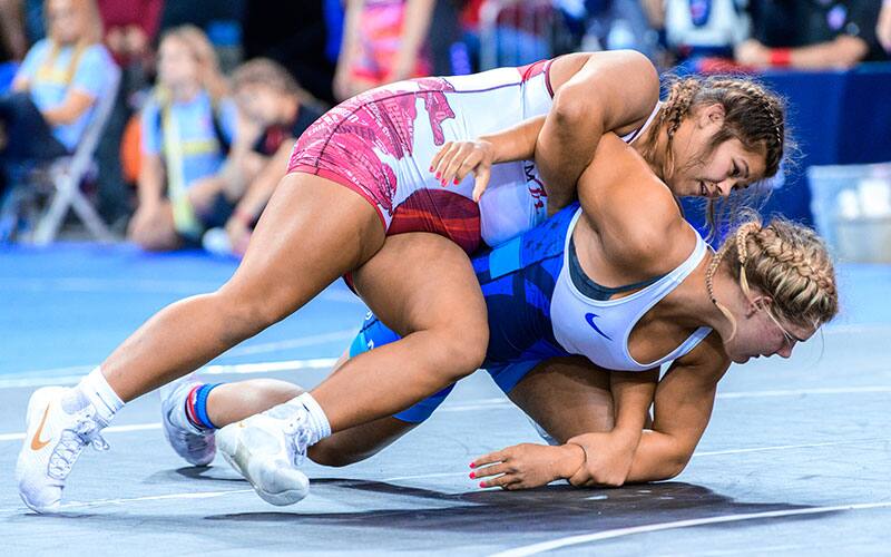 Sabrina Nauss (MI) runs an arm bar in the 2022 Junior Nationals.