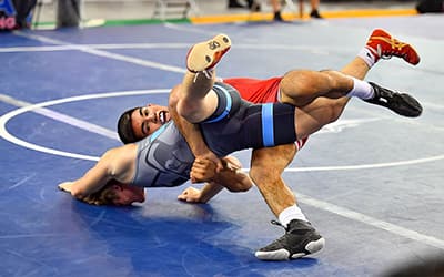 Aden Valencia of California locks up an opponent at the 2022 Junior Nationals. 
