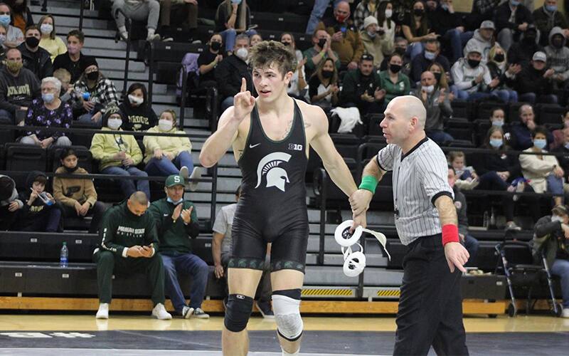 Michigan State's Layne Malczewski gets his hand raised following a win