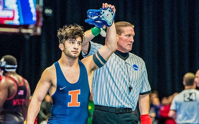 Isaiah Martinez of illinois with arm raised after a victory