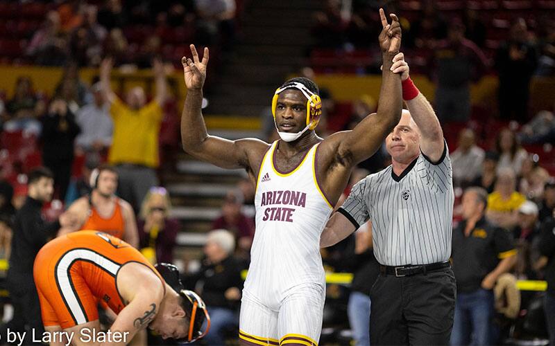 Kordell Norfleet (Arizona State) has arm raised after winning fourth Pac-12 title