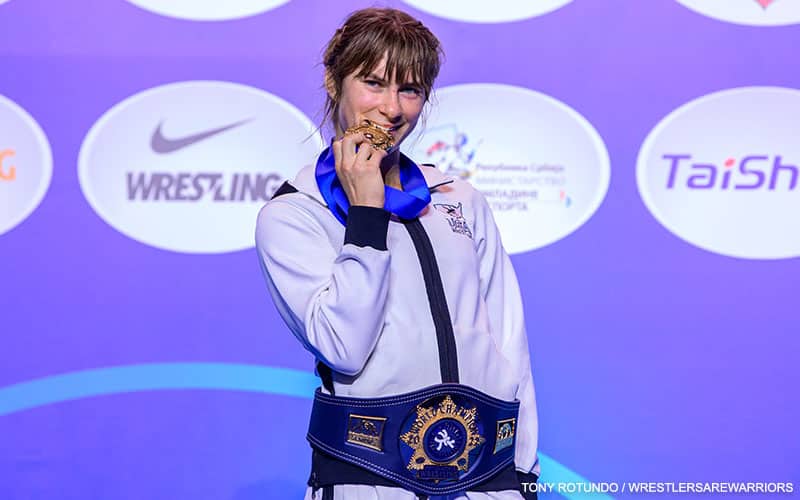 World champion Dom Parrish (USA) bites her gold medal.