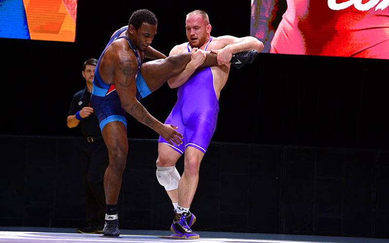 Kyle Snyder lifts J'den Cox's leg during their Super Match bout