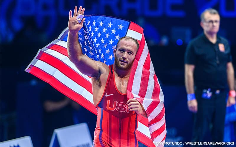 Kyle Snyder (USA) waves to the crowd with the American flag after winning the 2022 World title