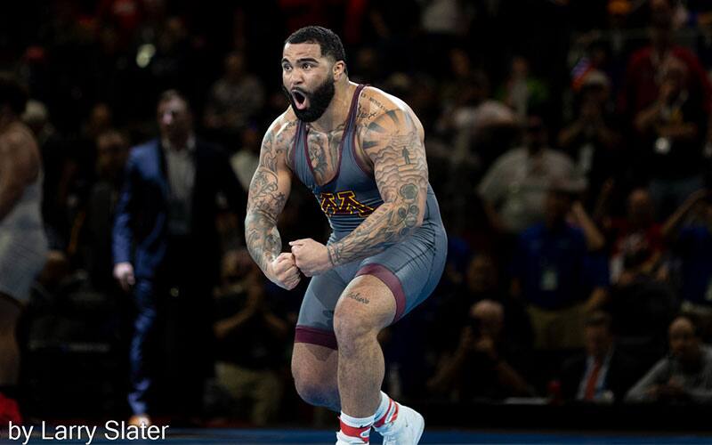 Gable Steveson (Minnesota) flexes after winning his second NCAA title.