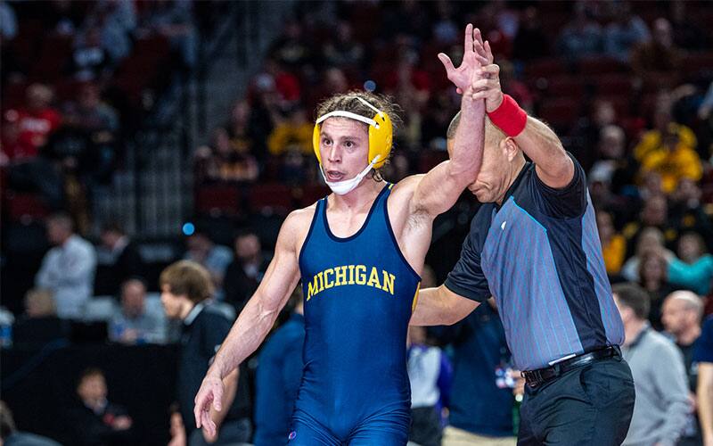 Nick Suriano (Michigan) with arm raised at 2022 Big Ten Championships