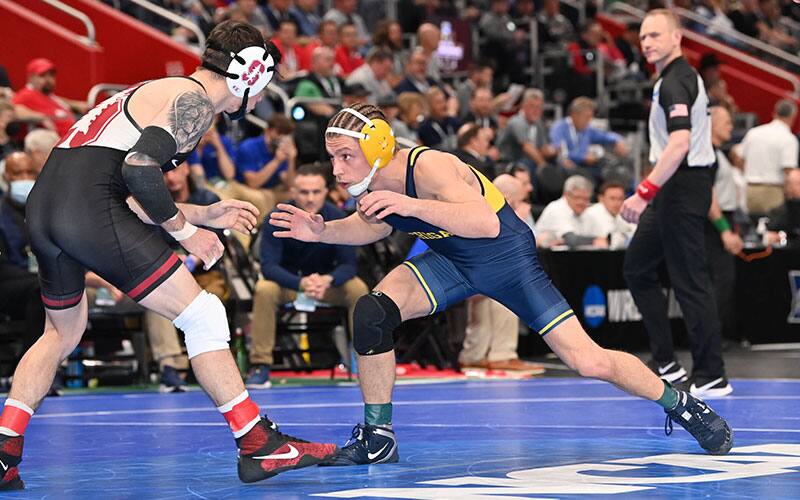 Nick Suriano (Michigan) competing in the first session at the 2022 NCAAs