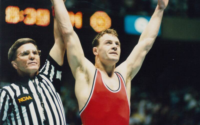 Darnold D. Henry raises Pat Smith's hand