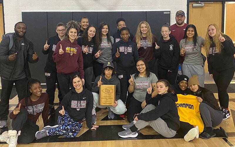 Indian Hills women's team poses with its trophy after winning the EX-Flex Open 