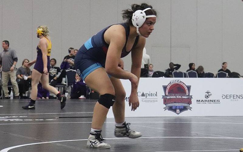 King University women's wrestler in her stance during competition